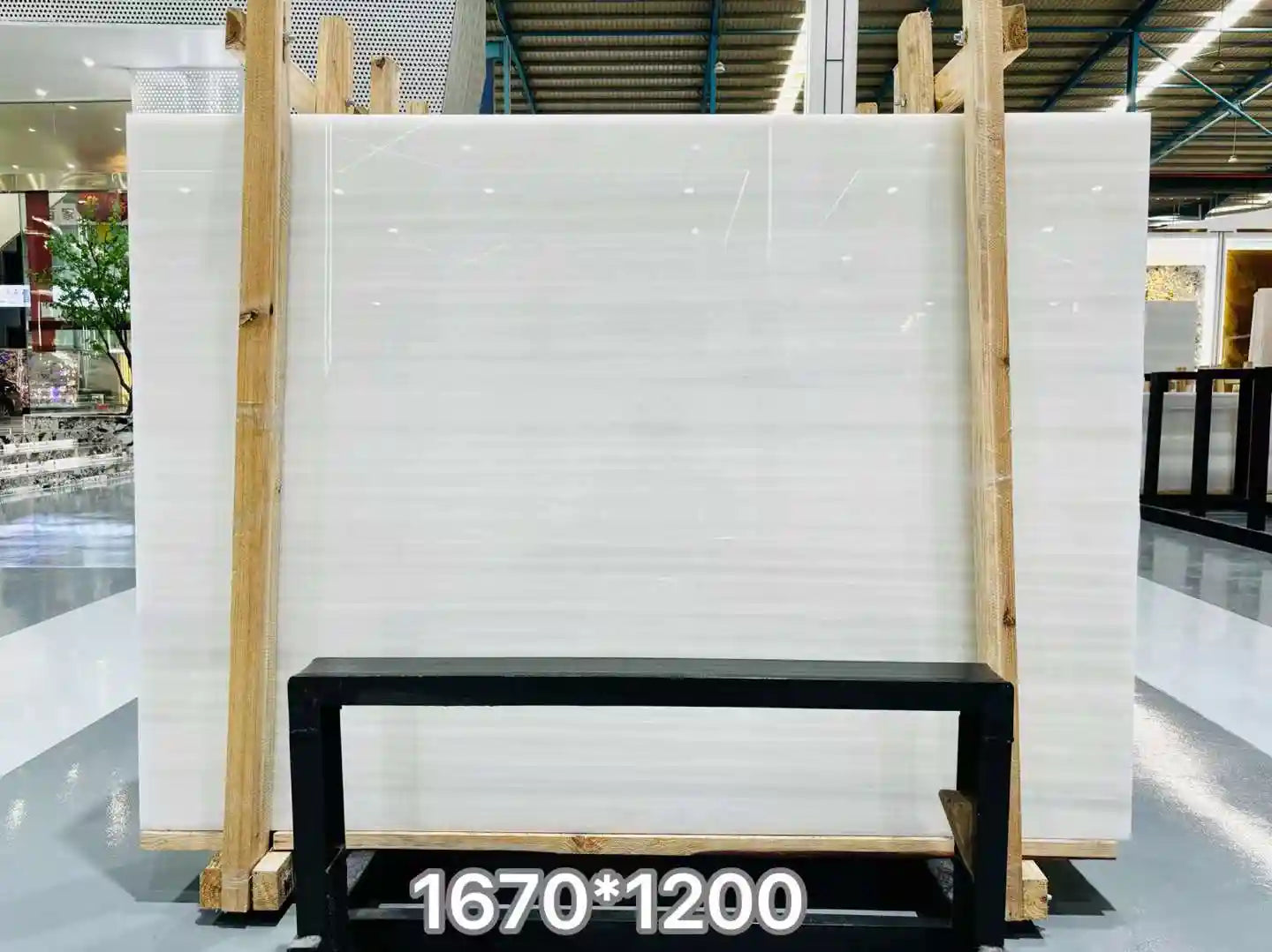 Athens White Onyx marble slab in a smooth white tone, perfect for high-end interior design projects.