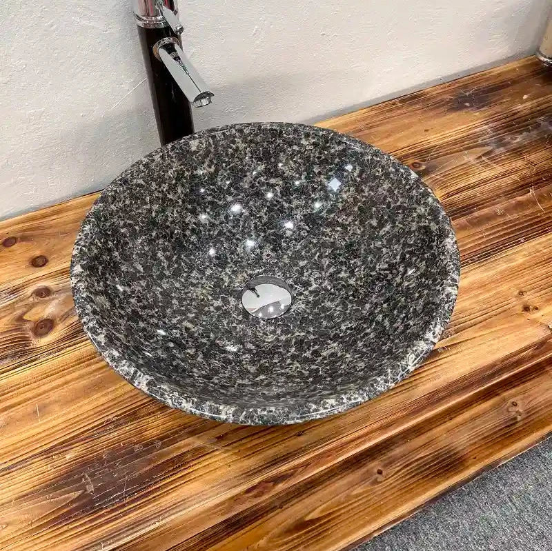 Round granite sink with custom options available.