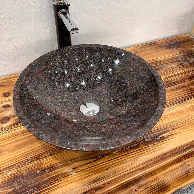 Round granite sink with custom options available.