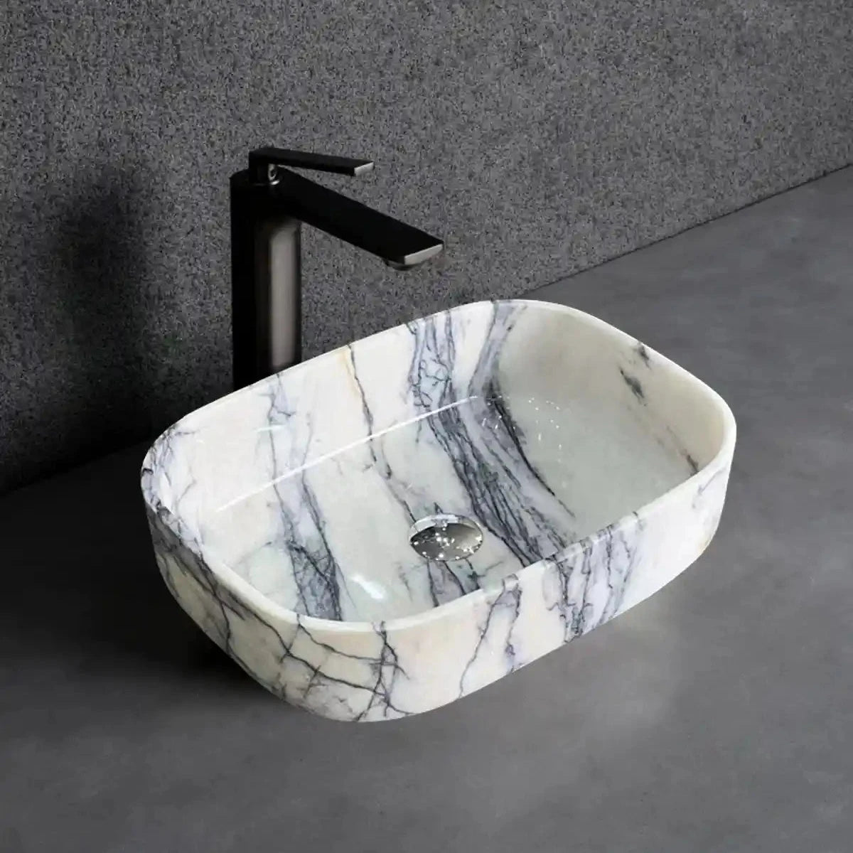 Rectangular marble sink with unique veining, available in custom options.