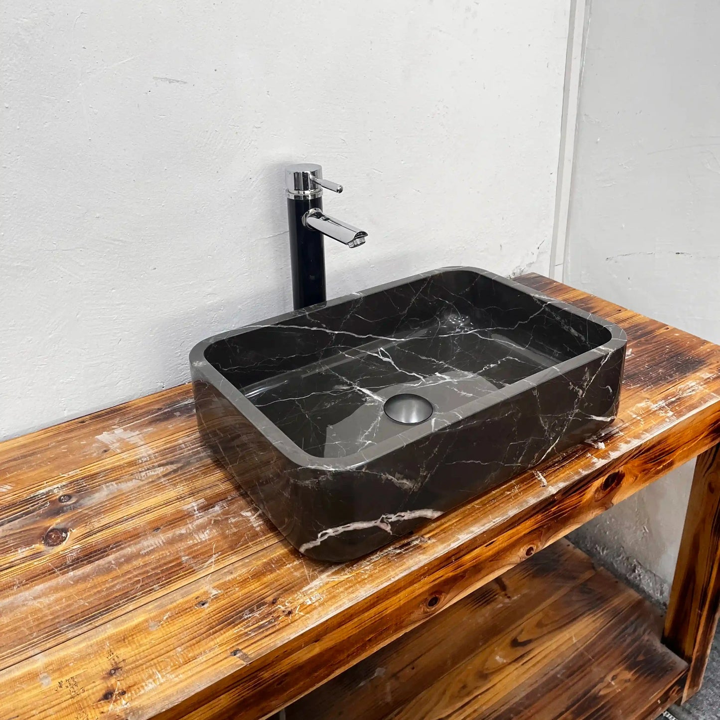 Rectangular marble sink with unique veining, available in custom options.