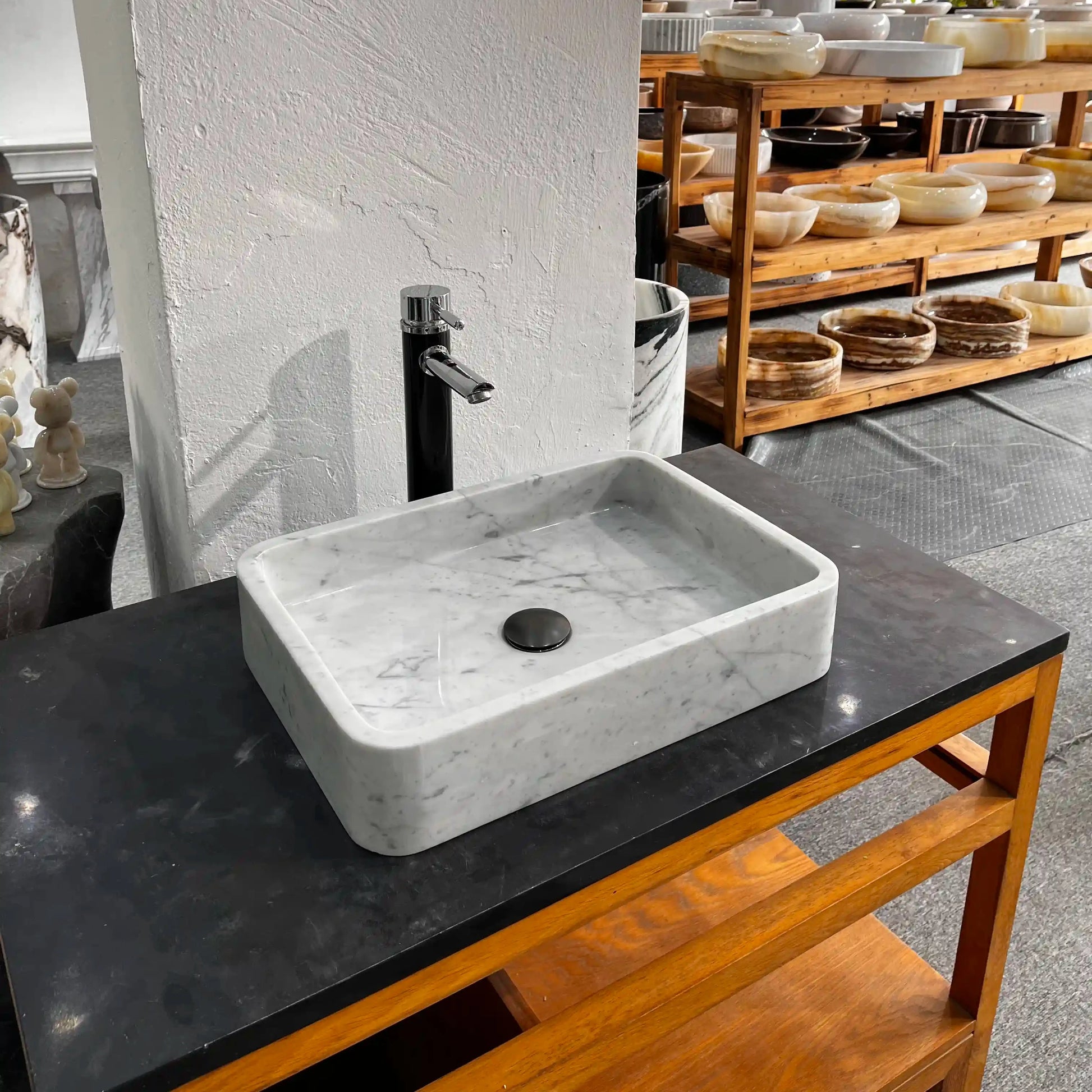 Rectangular marble sink with unique veining, available in custom options.