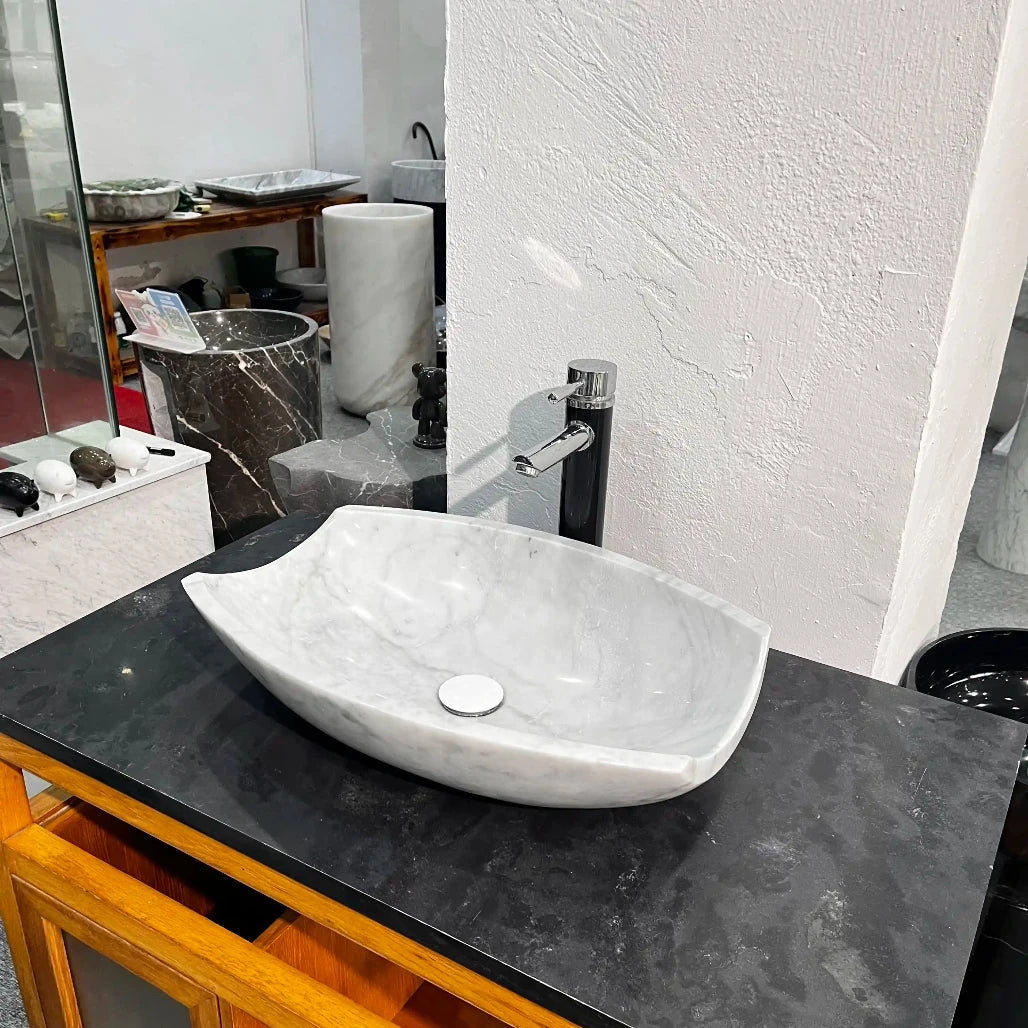 Oval marble sink with custom options available.