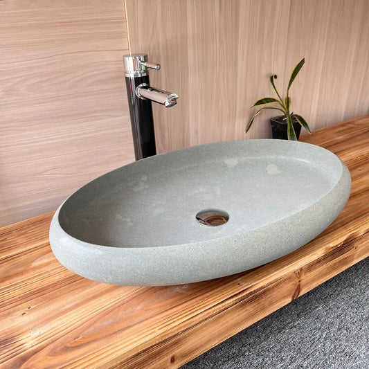 Oval marble sink with custom options available.