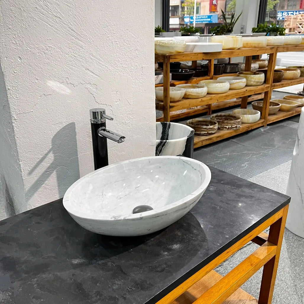 Oval marble sink with custom options available.