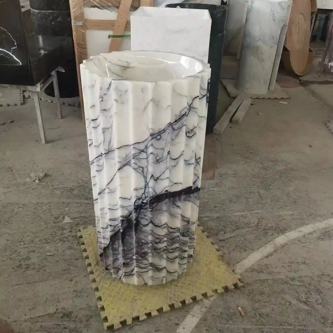 Standing pillar marble sink with custom options available.